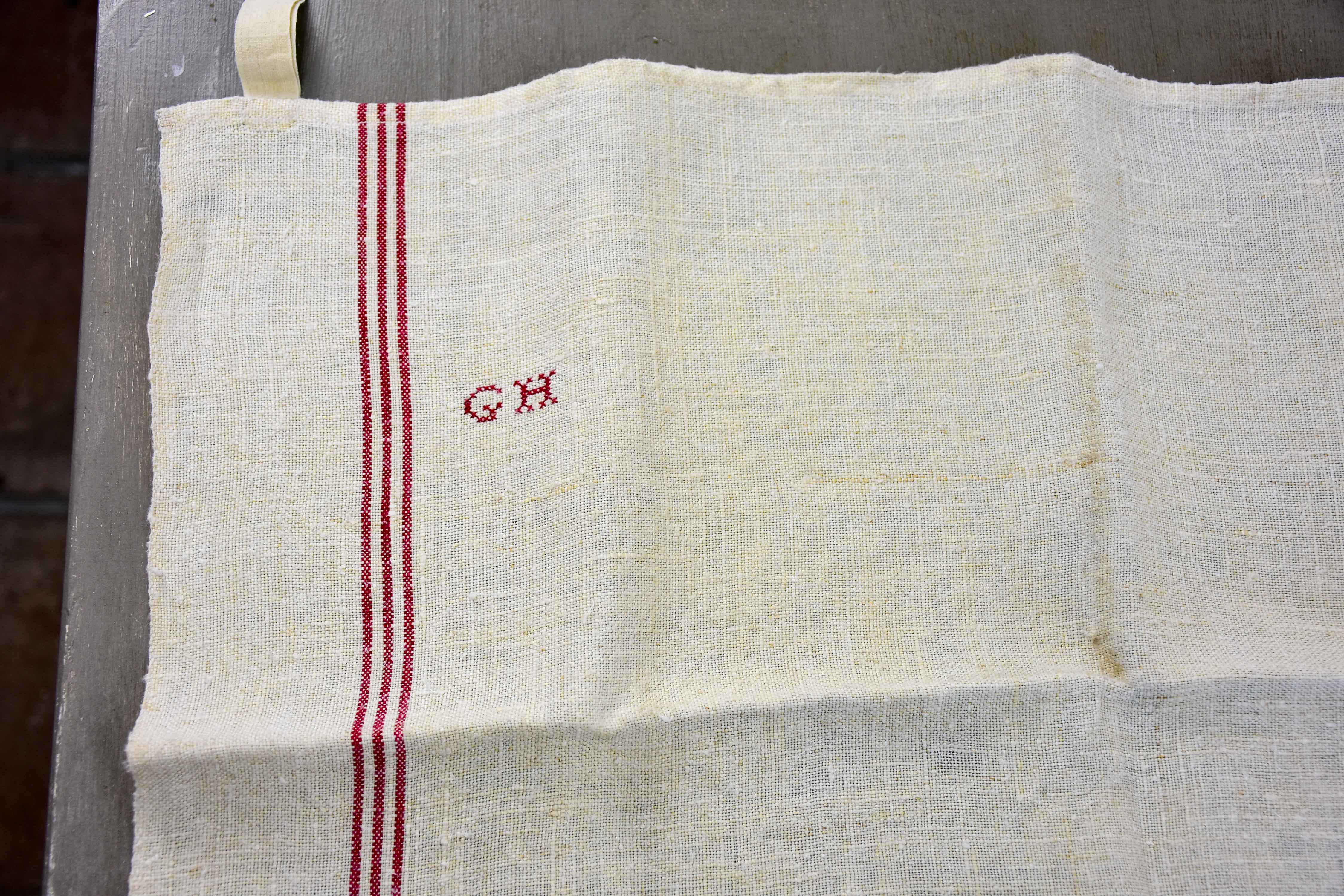 Four French tea towels with GH monogram