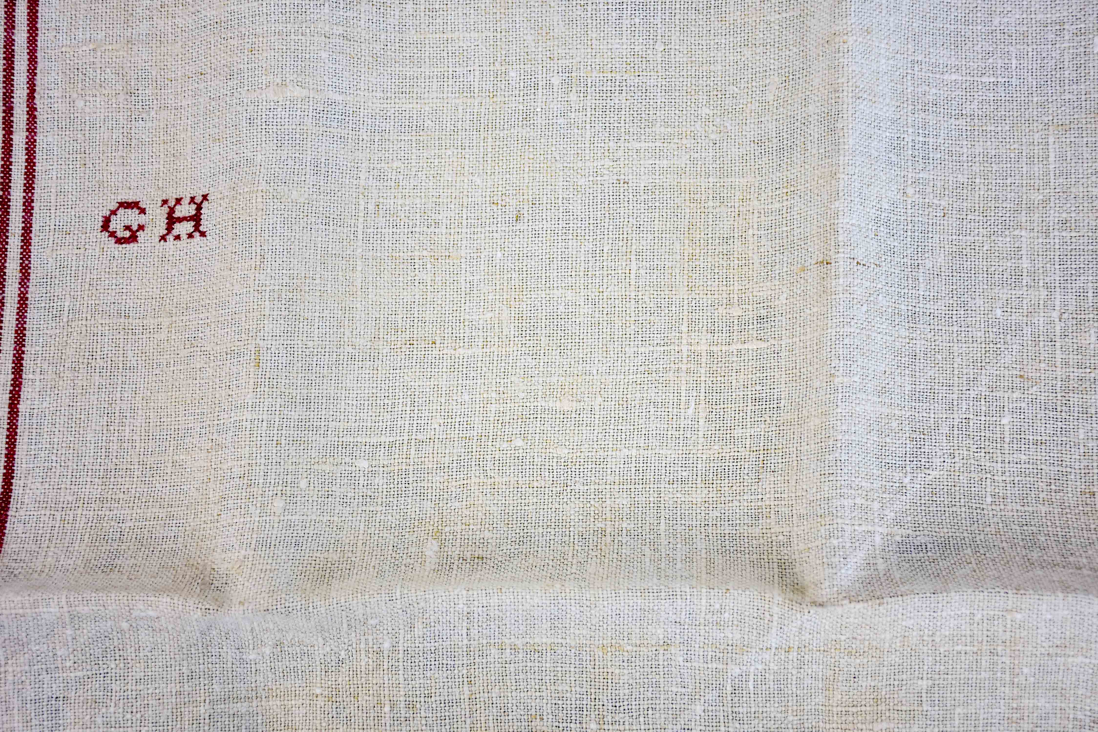 Four French tea towels with GH monogram