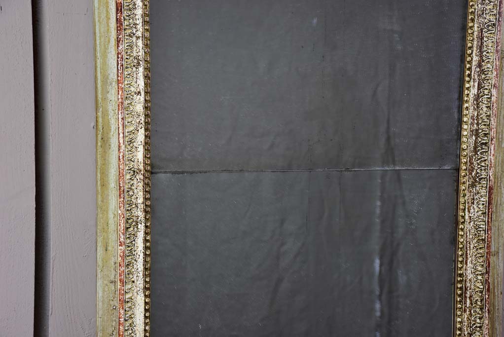 Pretty Louis XVI trumeau mirror with navy blue and fatigued gilding 25½" x 53½"
