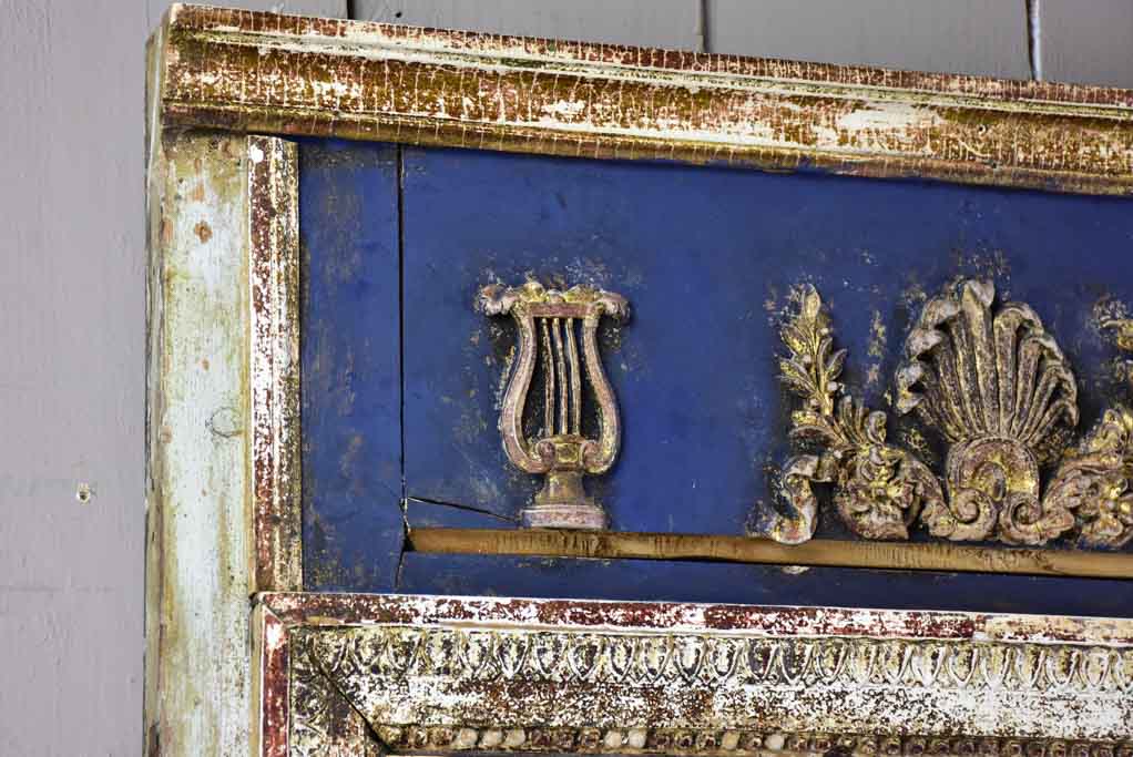 Pretty Louis XVI trumeau mirror with navy blue and fatigued gilding 25½" x 53½"