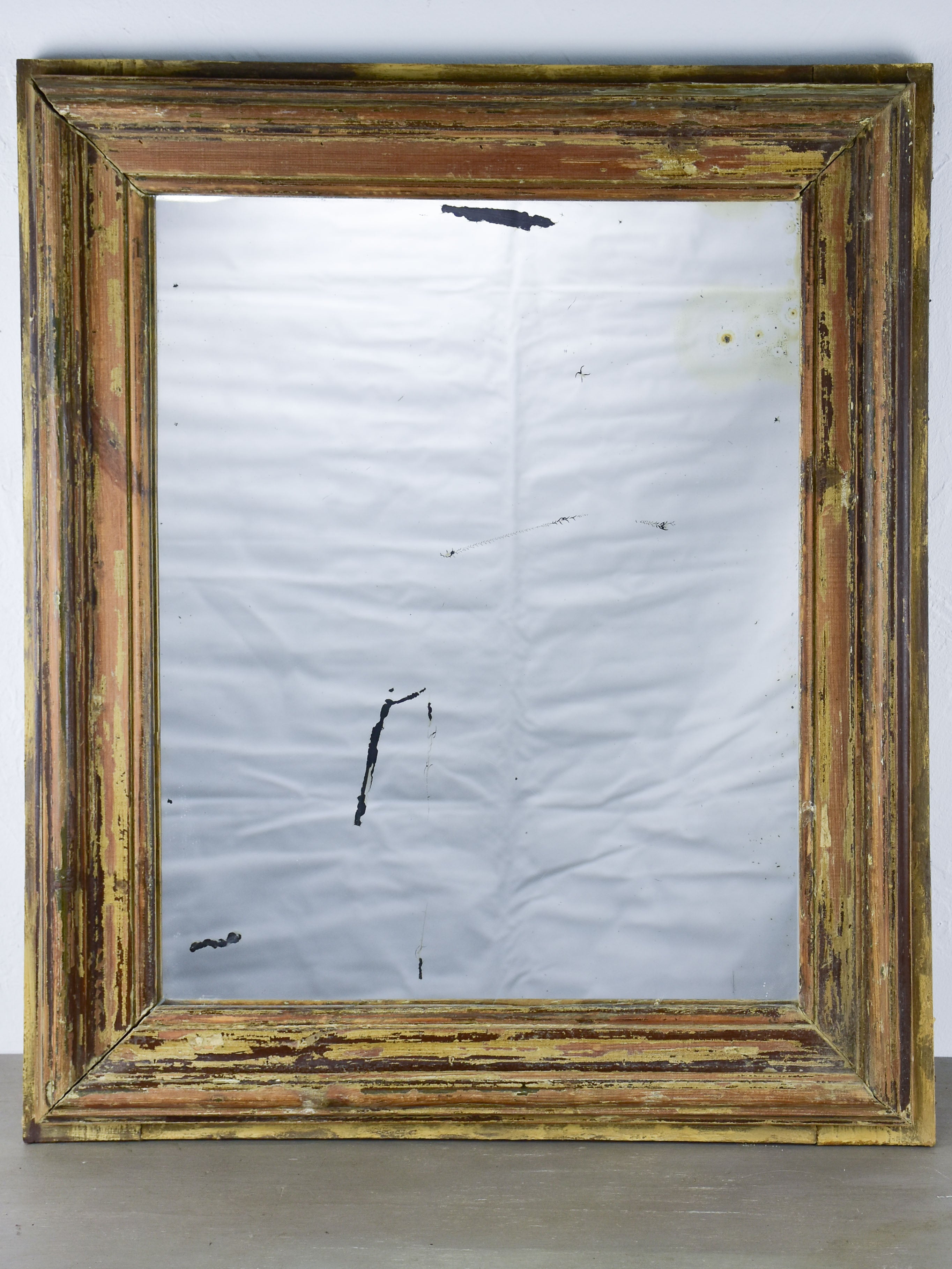 Rustic antique French mirror with dark rectangular frame