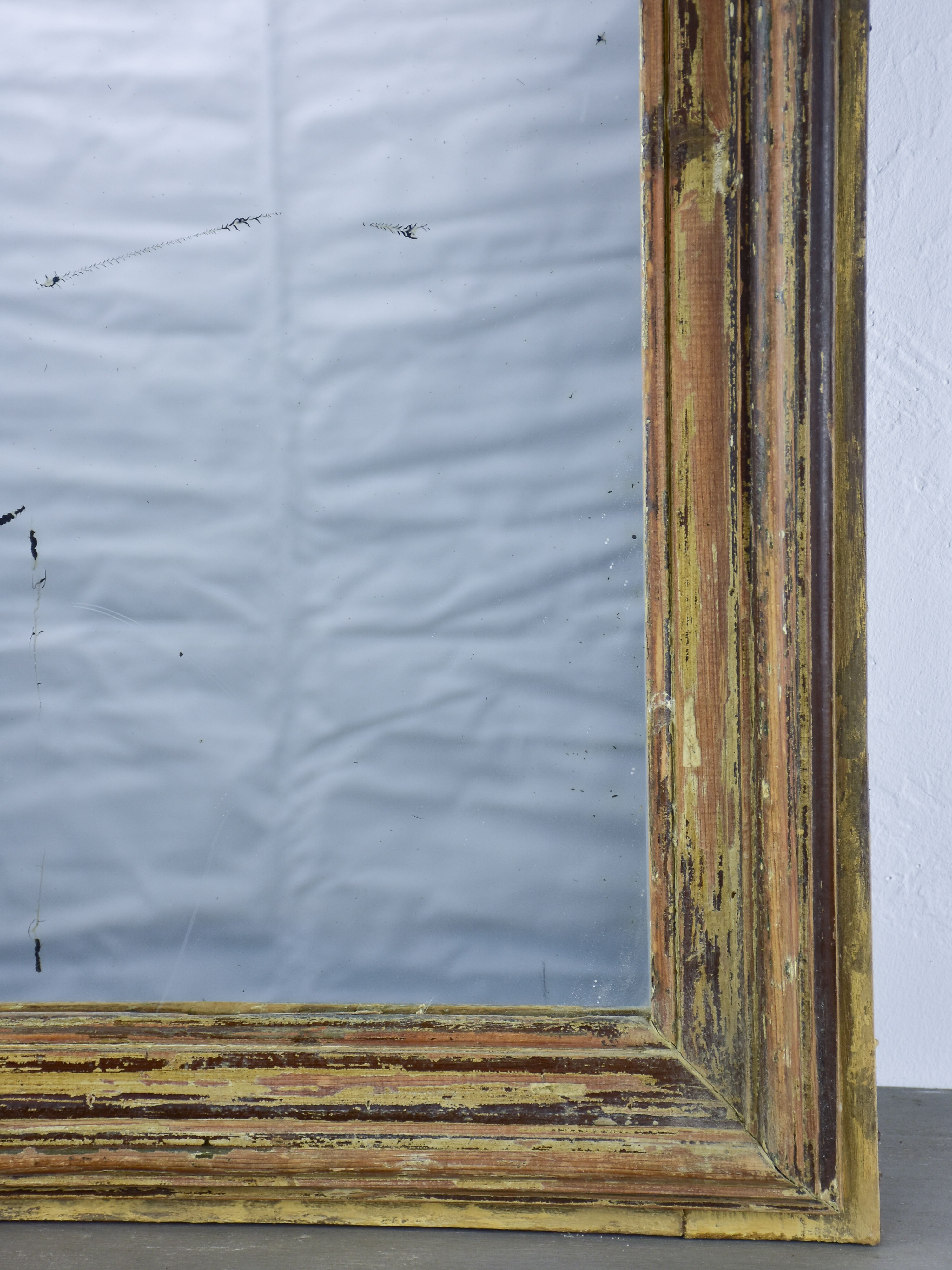 Rustic antique French mirror with dark rectangular frame