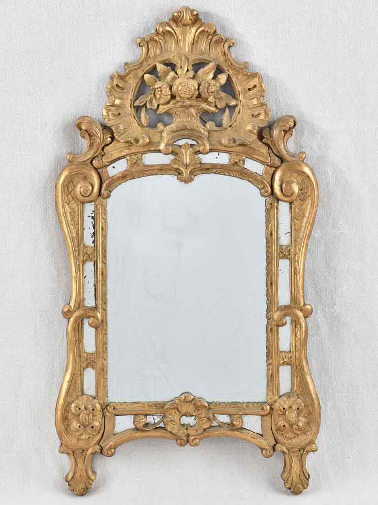 Small 19th century French mirror - gilded w/ bouquet pediment - 24¾" x 13¾"