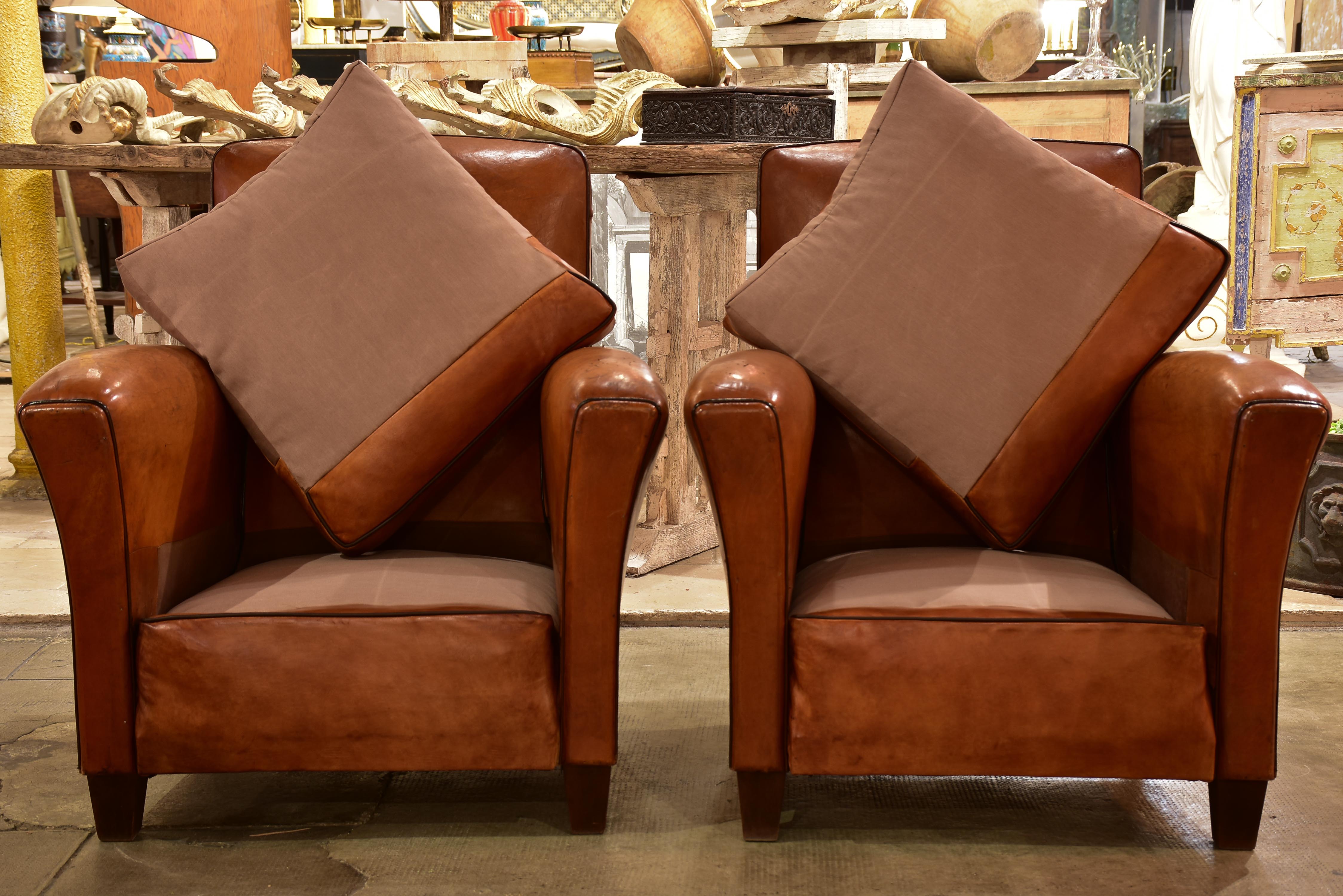 Pair of vintage French leather club chairs with square backs