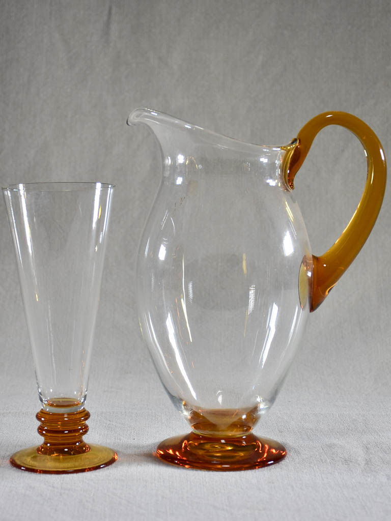 Set of eight tumblers with matching pitcher - clear and amber glass