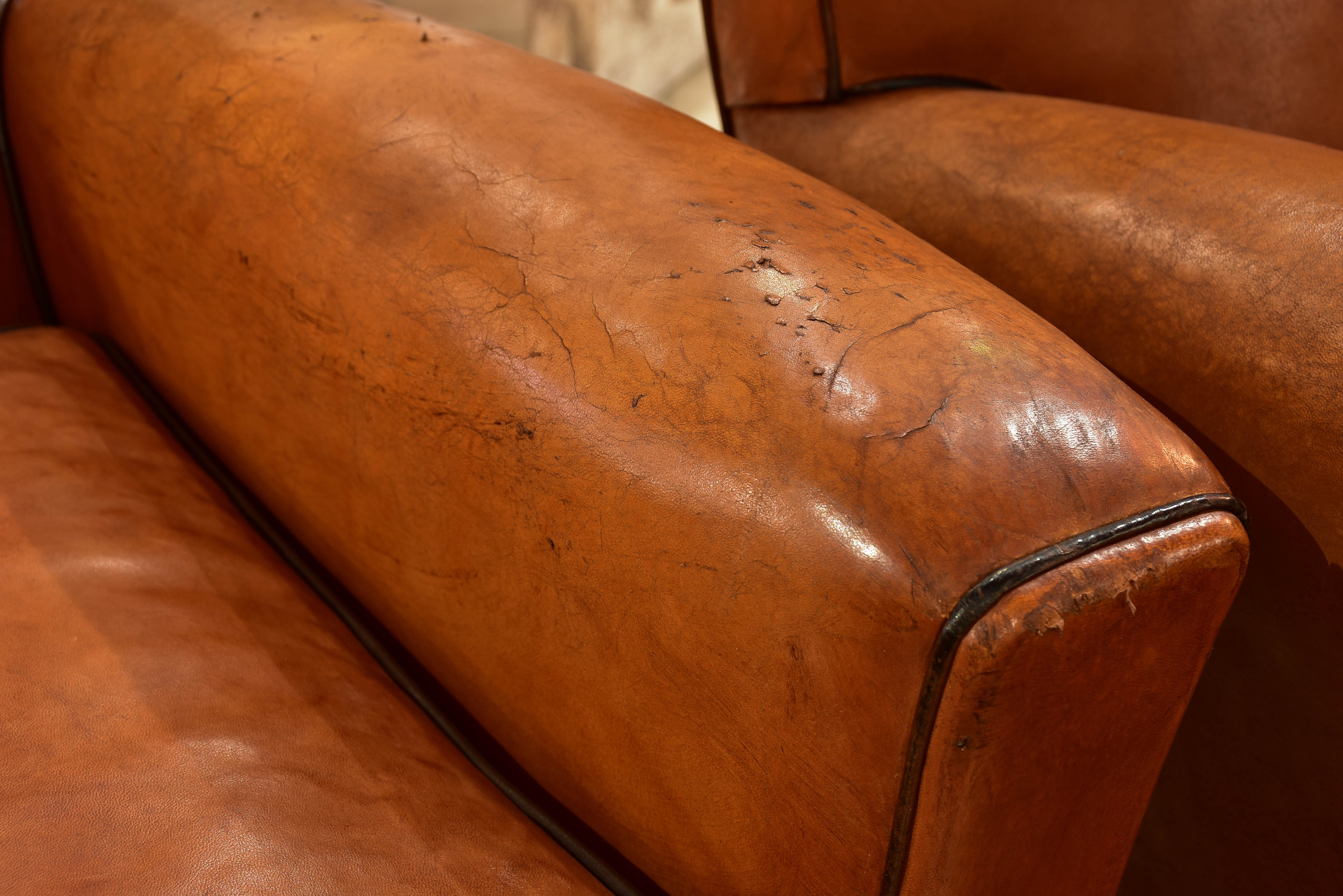 Pair of vintage French leather club chairs with square backs