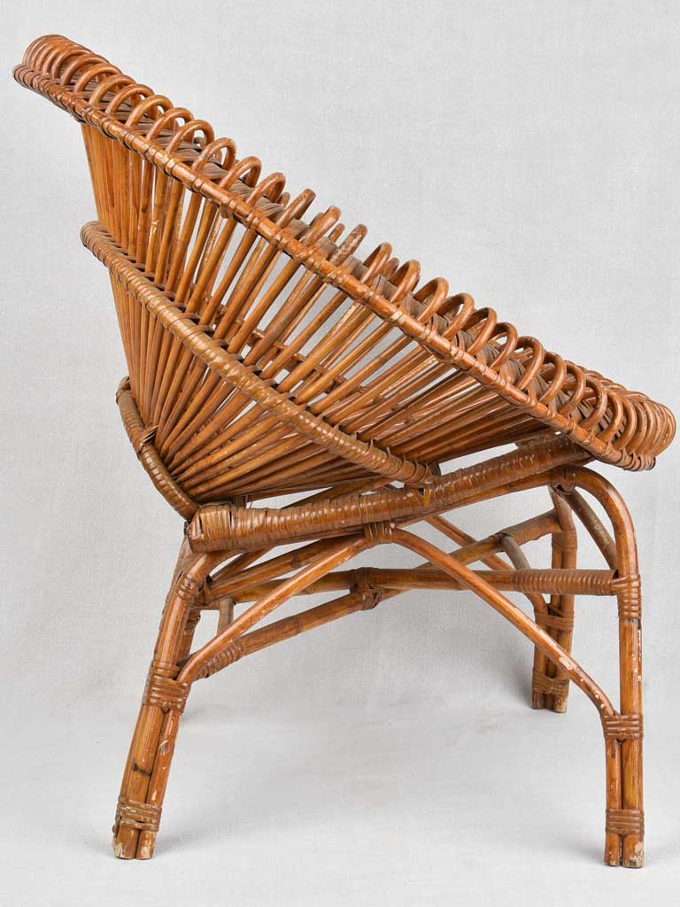 Pair of Janine Abraham wicker 'sunburst' armchairs