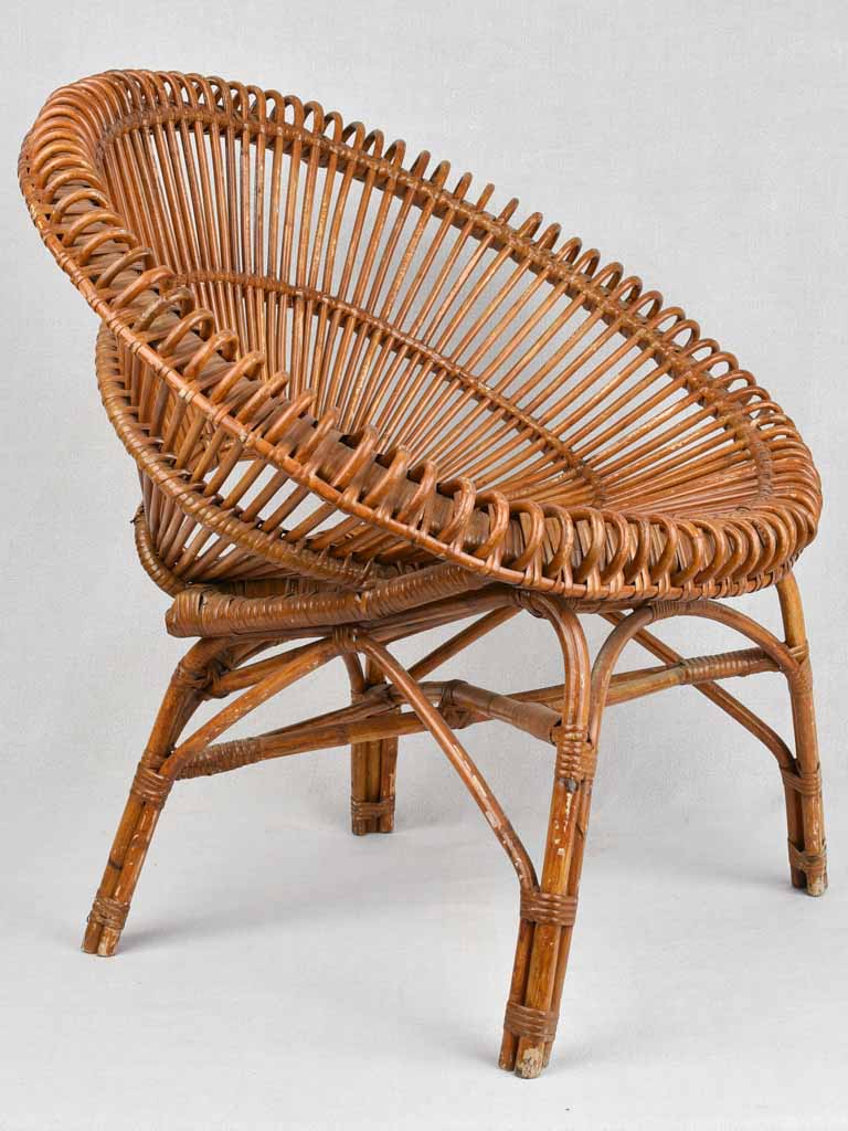 Pair of Janine Abraham wicker 'sunburst' armchairs
