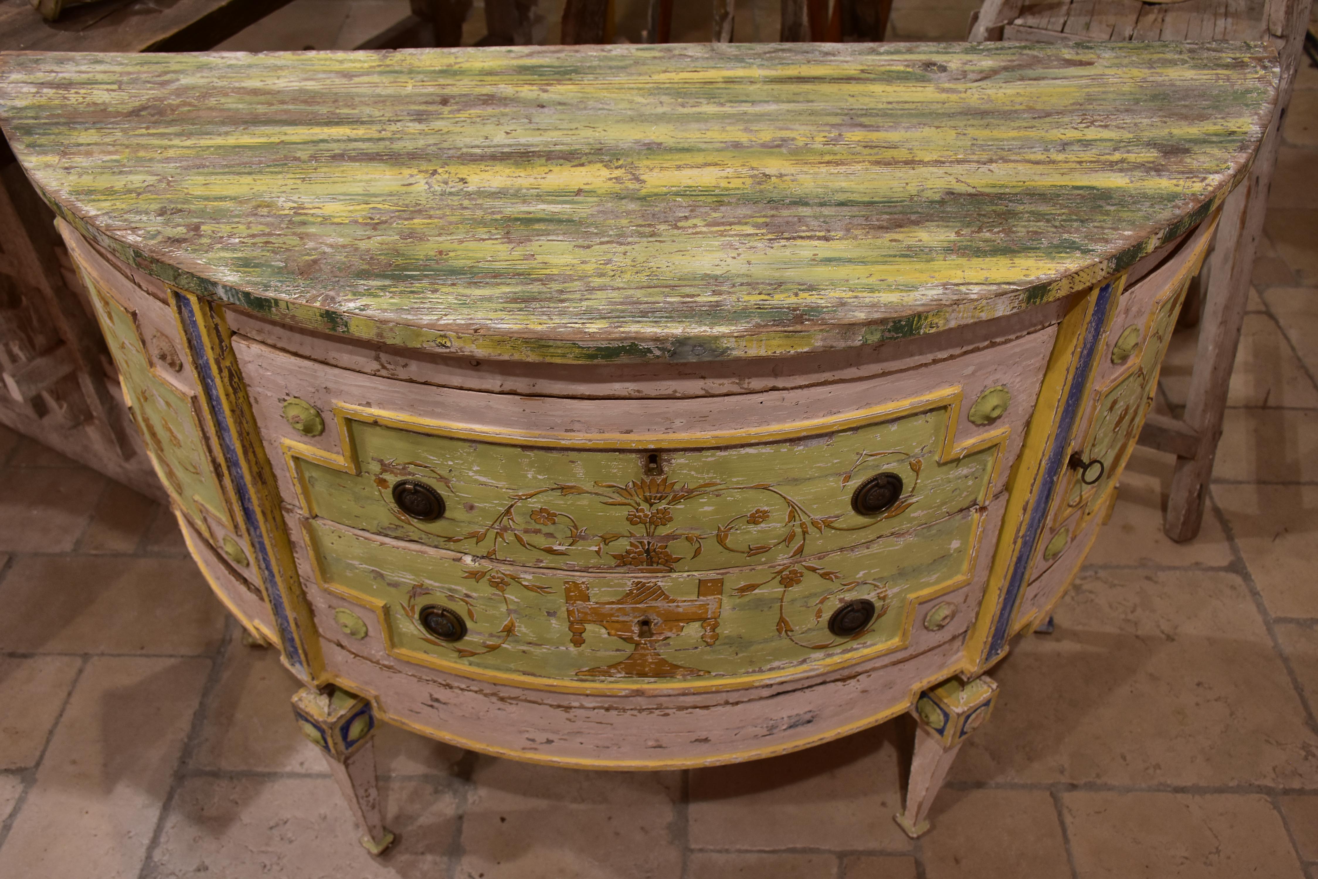 Demilune commode with pink, green, yellow and blue patina
