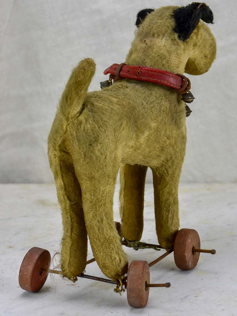 Antique French toy dog on wheels