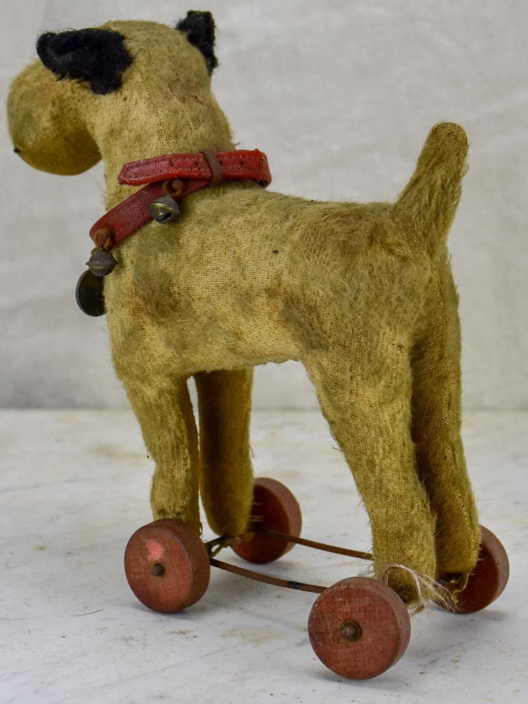 Antique French toy dog on wheels