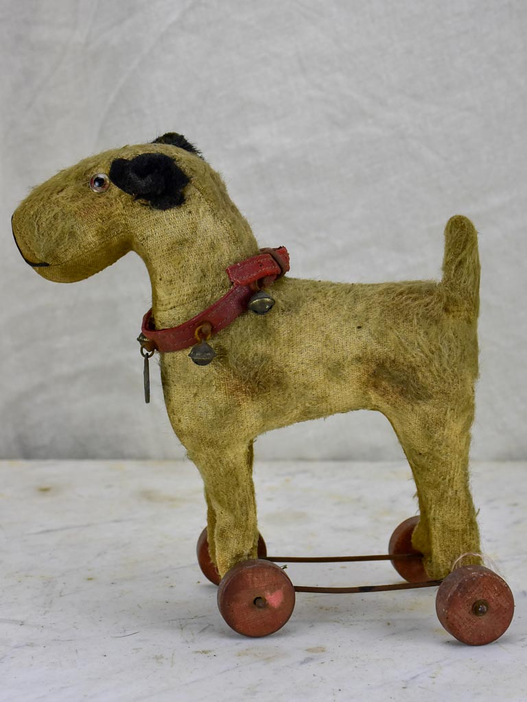 Antique French toy dog on wheels