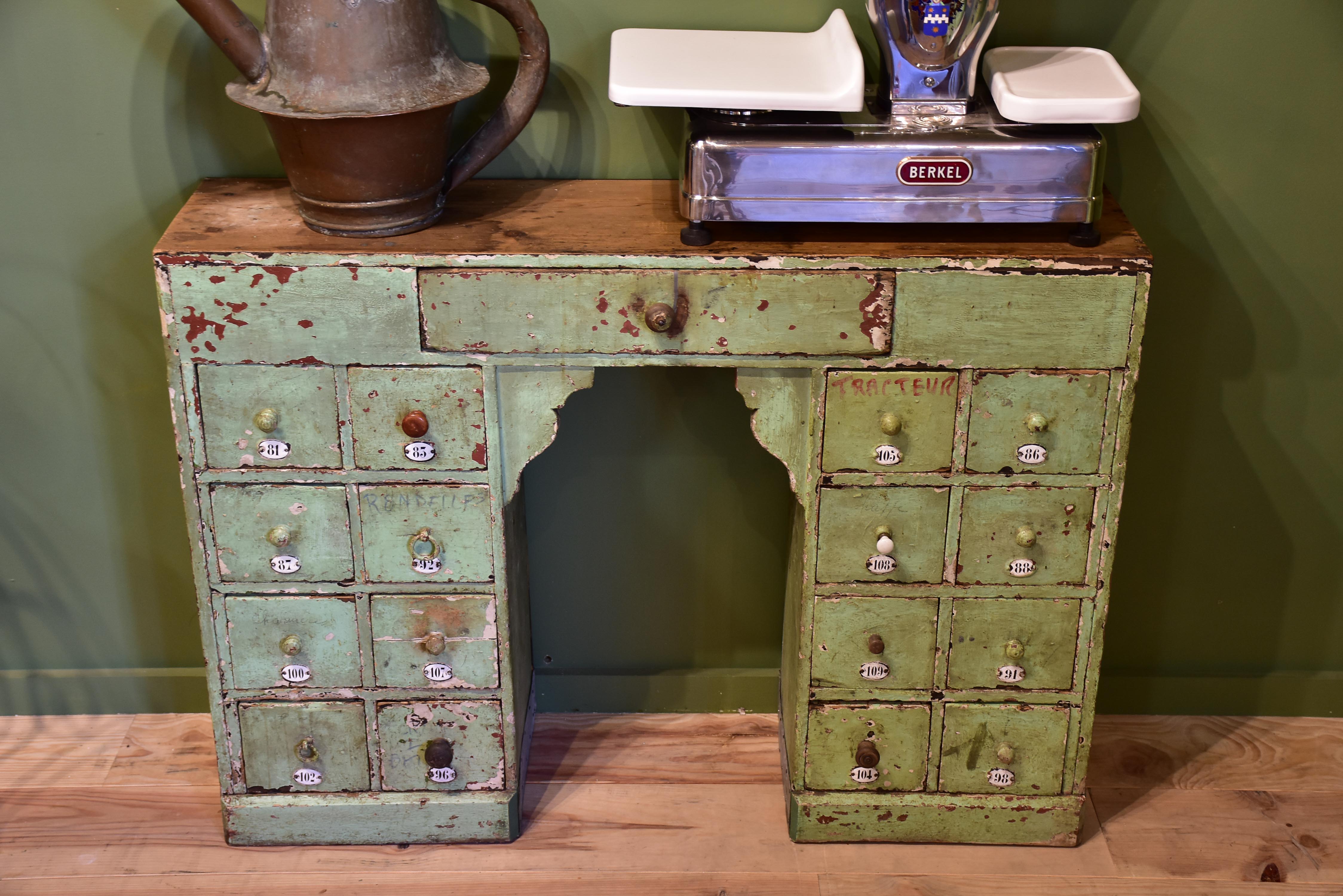 Set of small merchant's drawers with green patina
