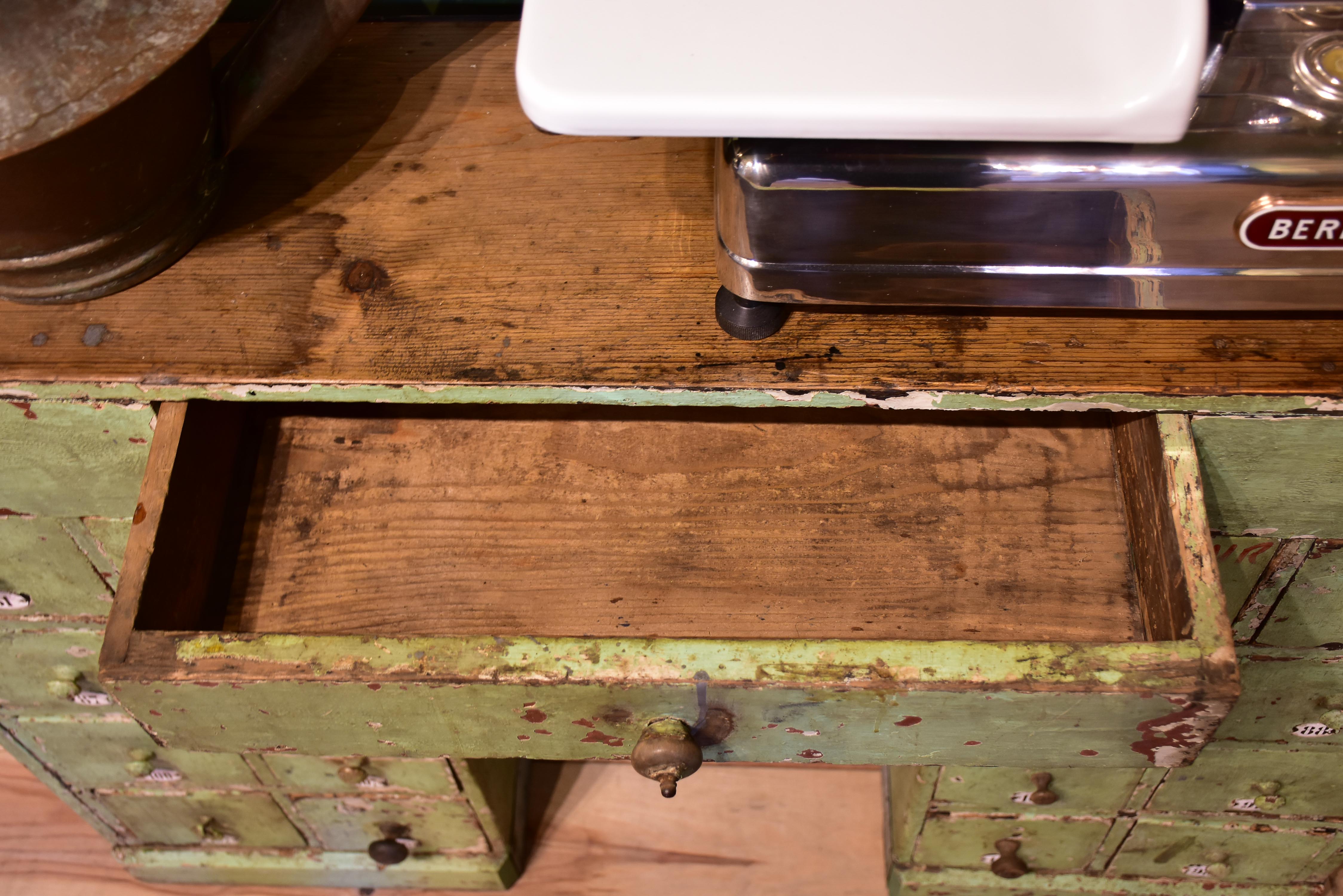 Set of small merchant's drawers with green patina