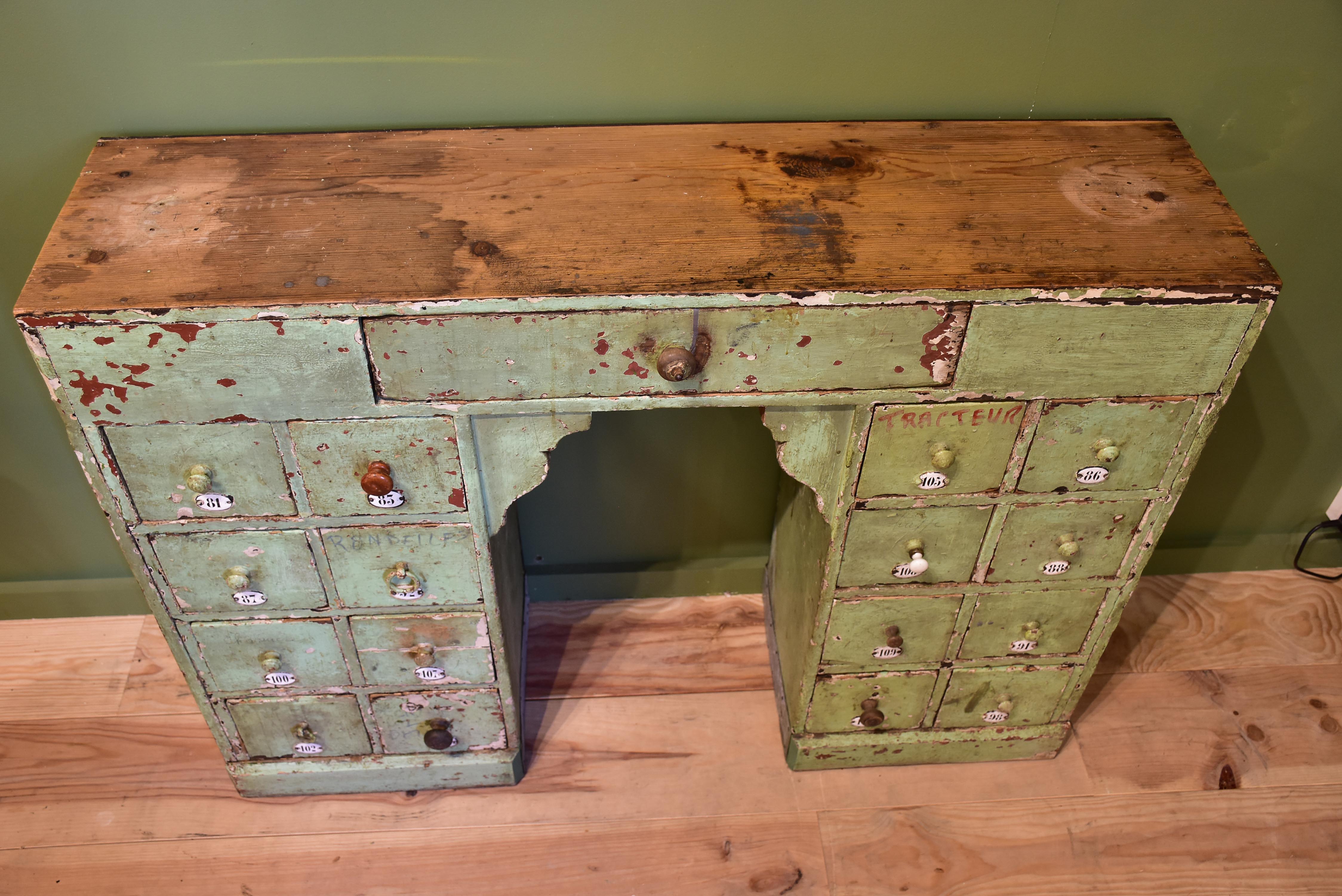 Set of small merchant's drawers with green patina