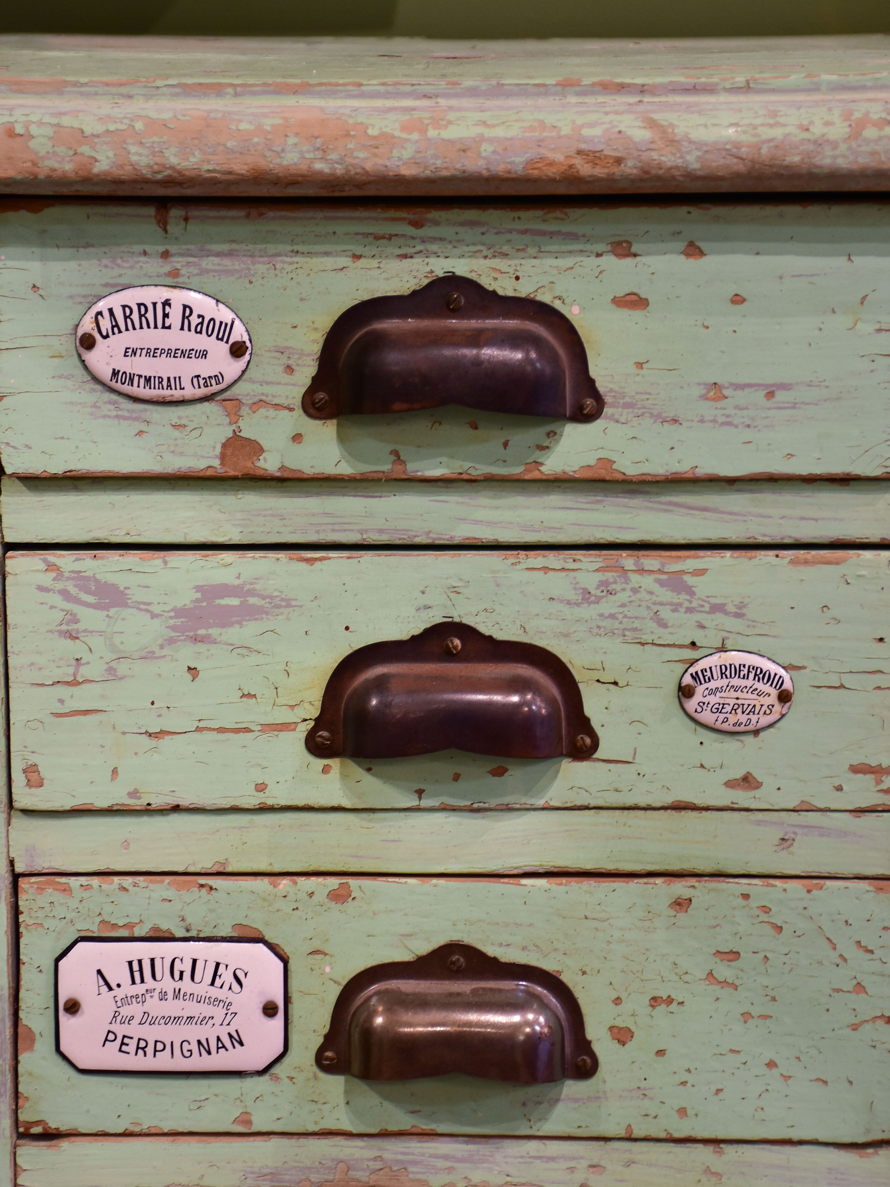Set of small merchant's drawers with green patina