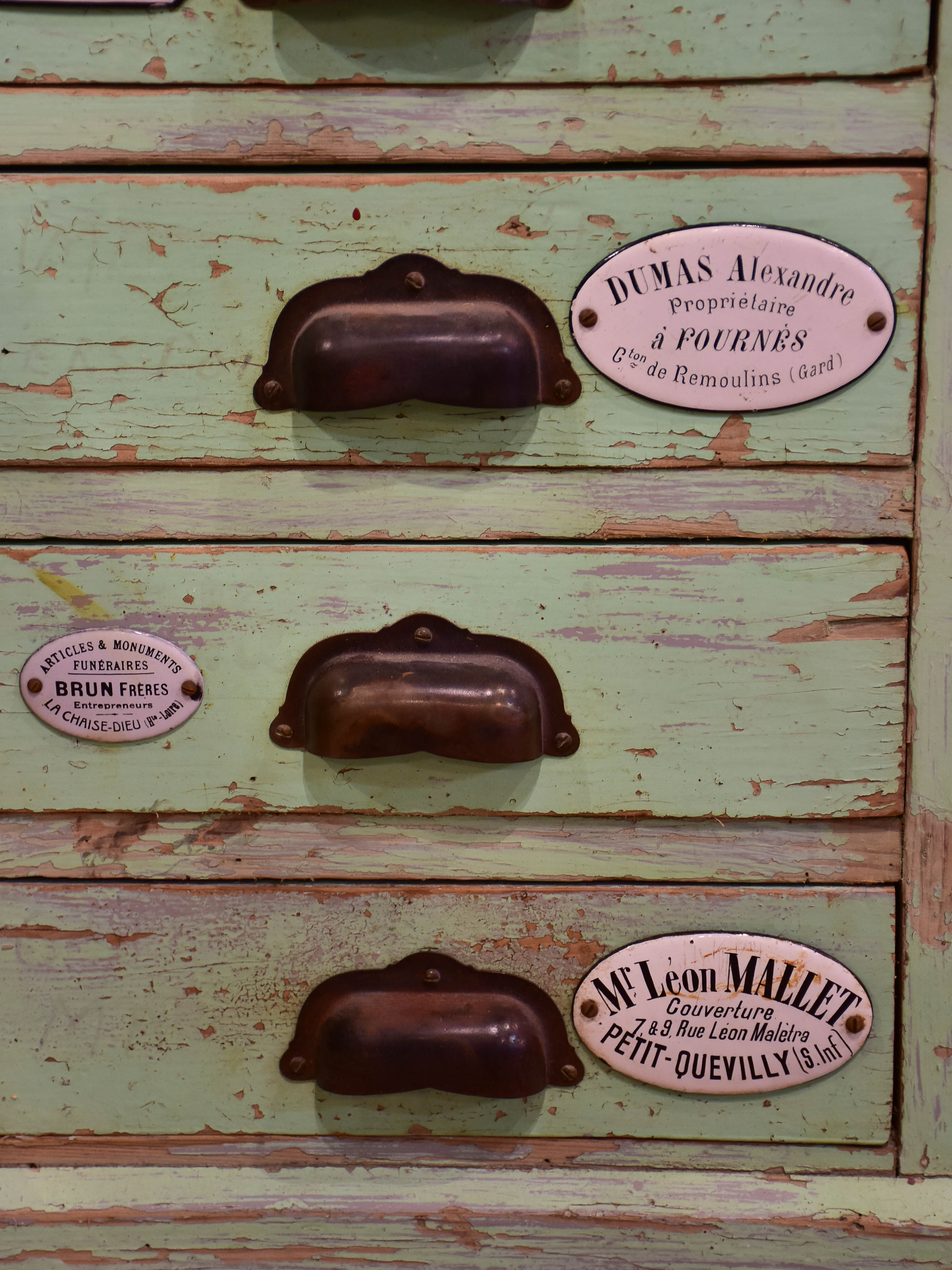 Set of small merchant's drawers with green patina