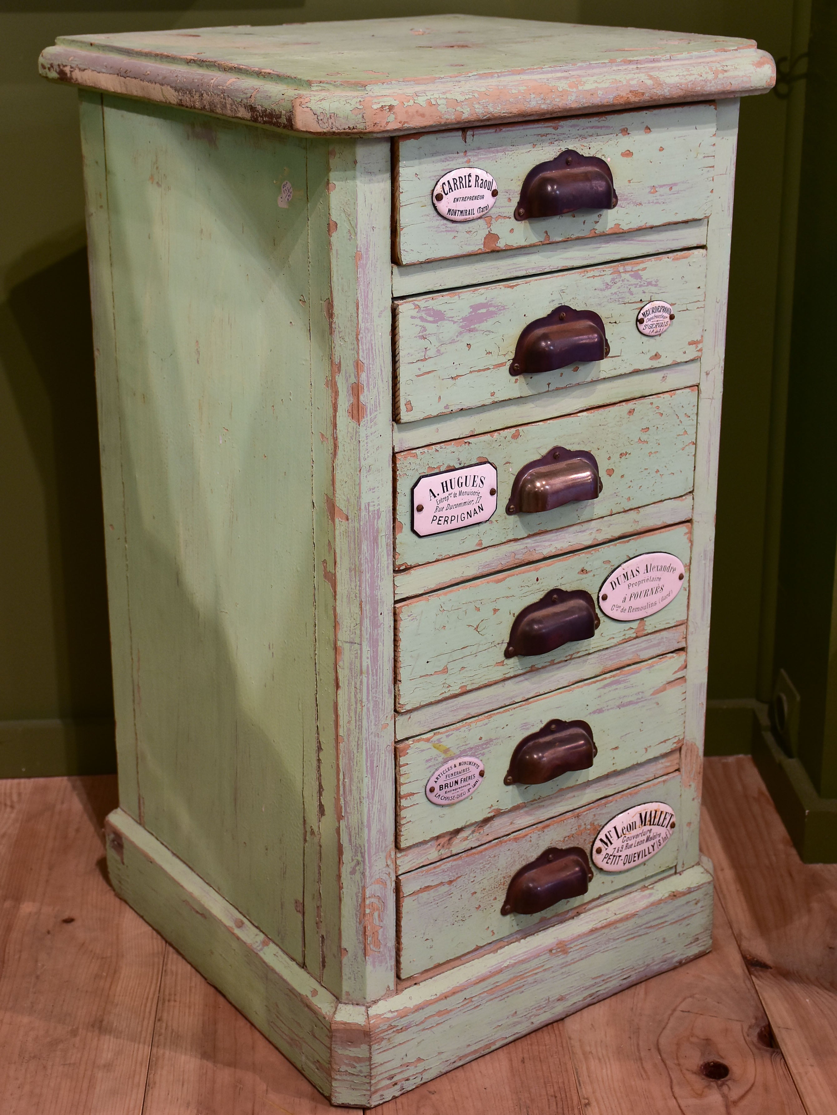 Set of small merchant's drawers with green patina