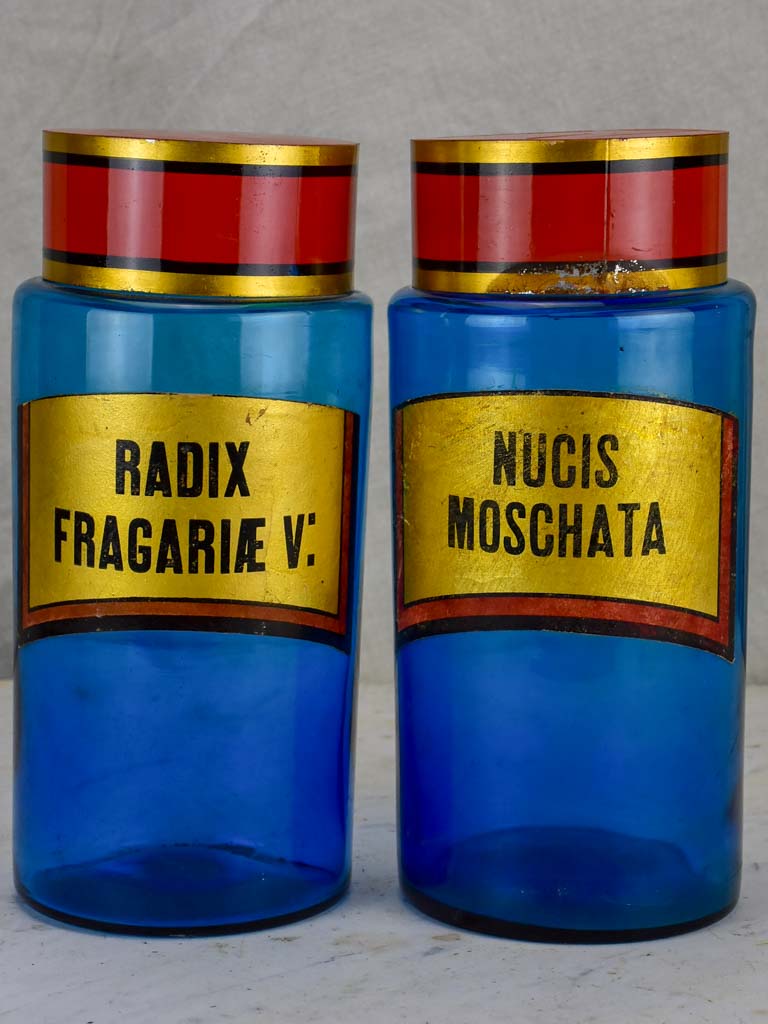 Two blue glass antique French apothecary jars with lids
