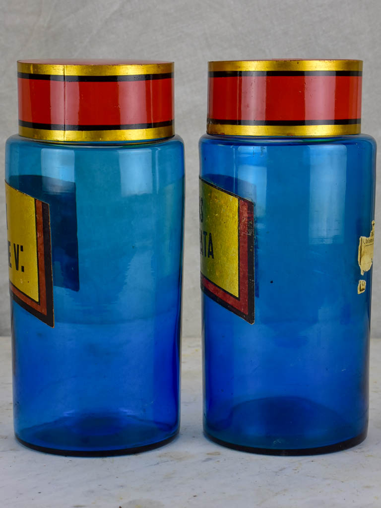 Two blue glass antique French apothecary jars with lids