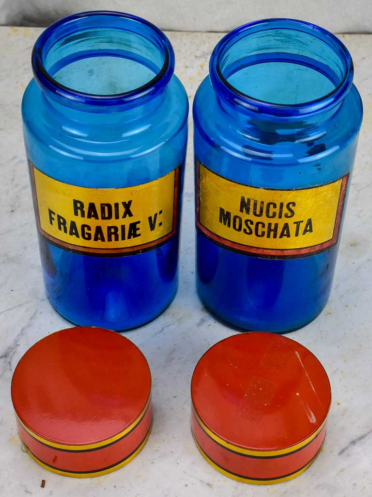 Two blue glass antique French apothecary jars with lids