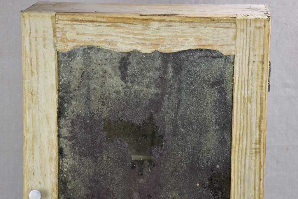 Medicine cabinet with timeworn mirror 1930's