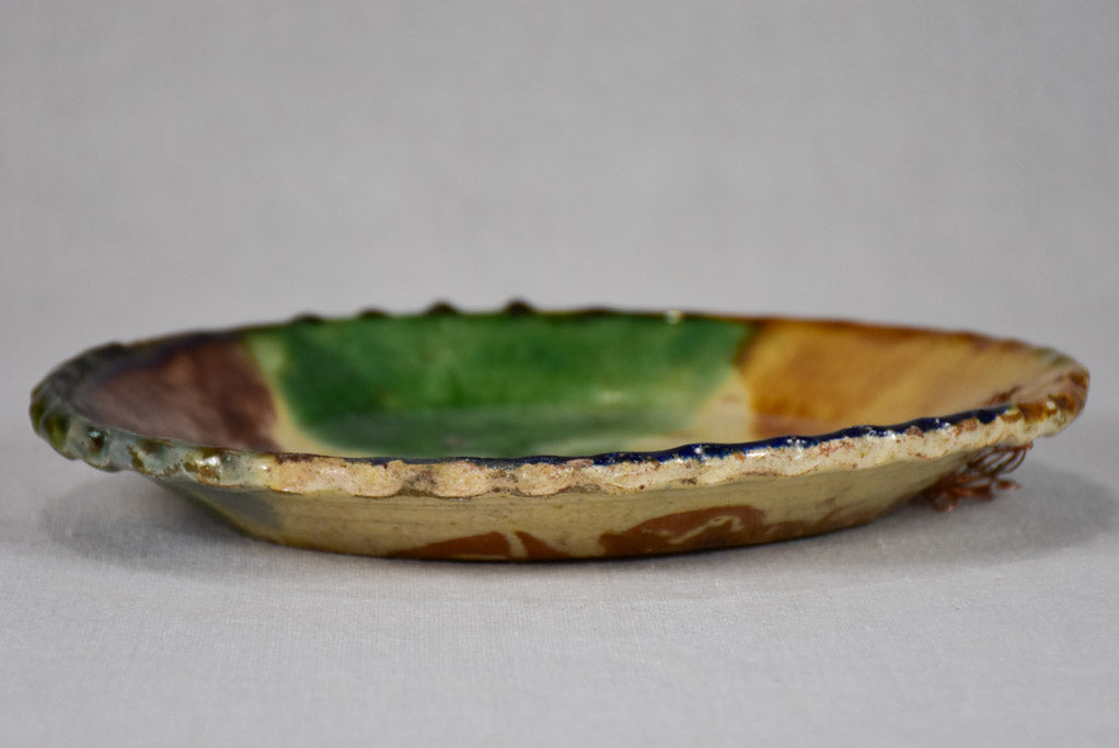 Antique French plate with brown, yellow, blue, and green glaze 9¾"