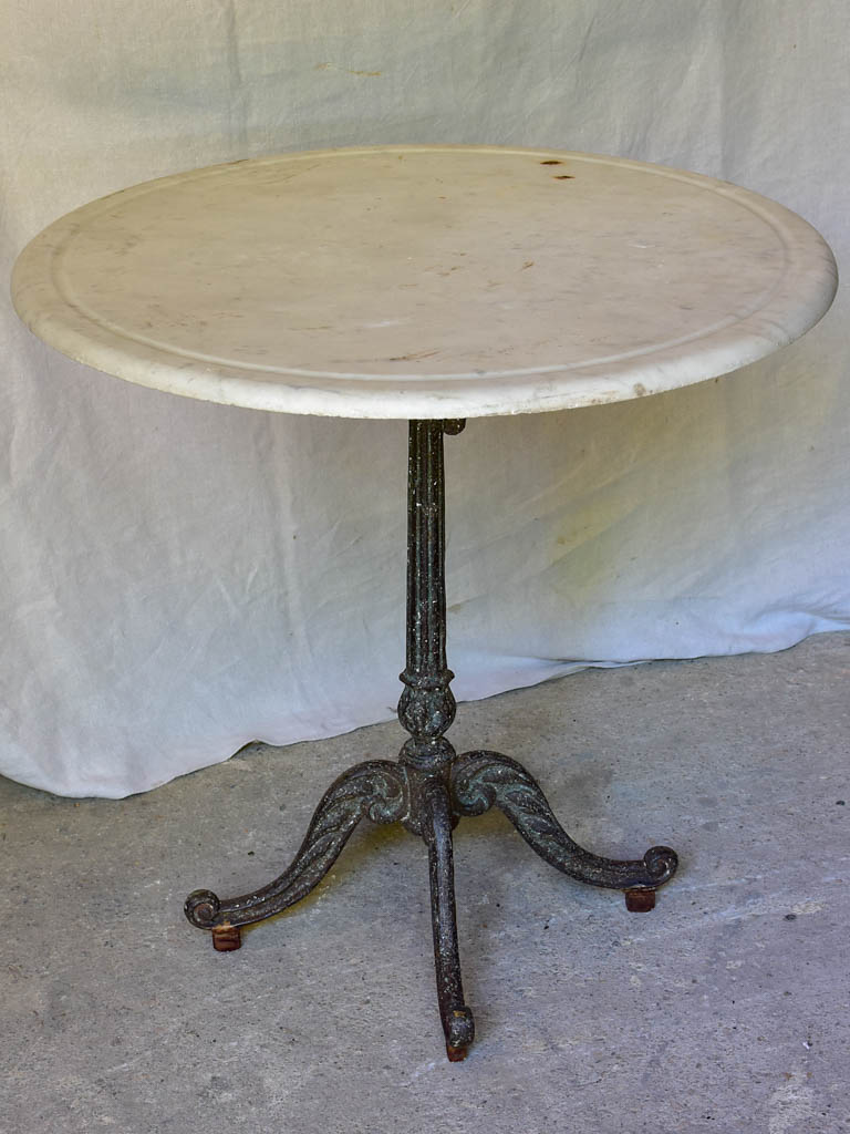 Late 19th Century round French table with marble top and cast iron base 31"