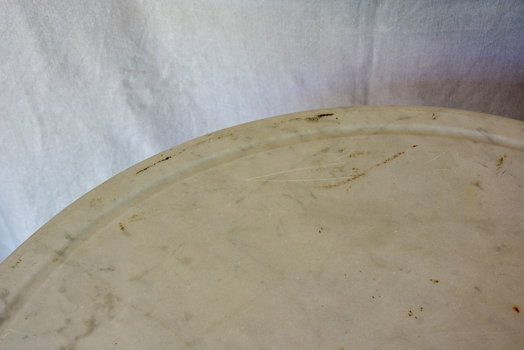 Late 19th Century round French table with marble top and cast iron base 31"