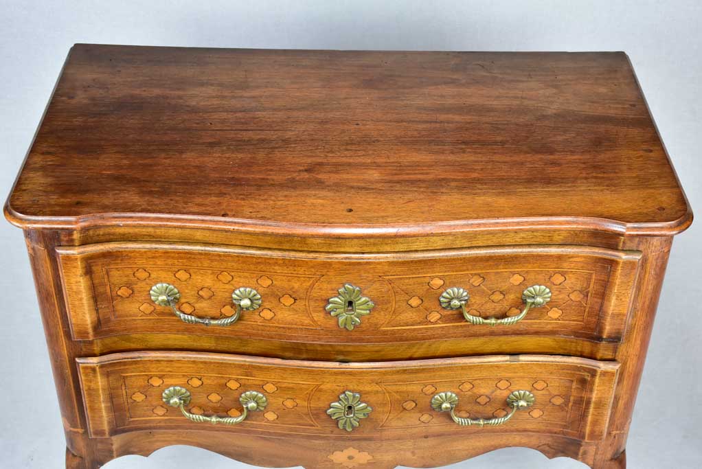 Antique French marquetry sauteuse commode with hoof feet