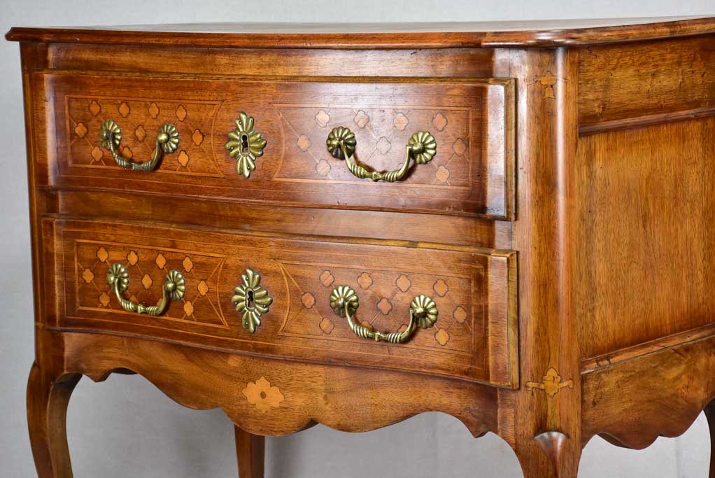 Antique French marquetry sauteuse commode with hoof feet