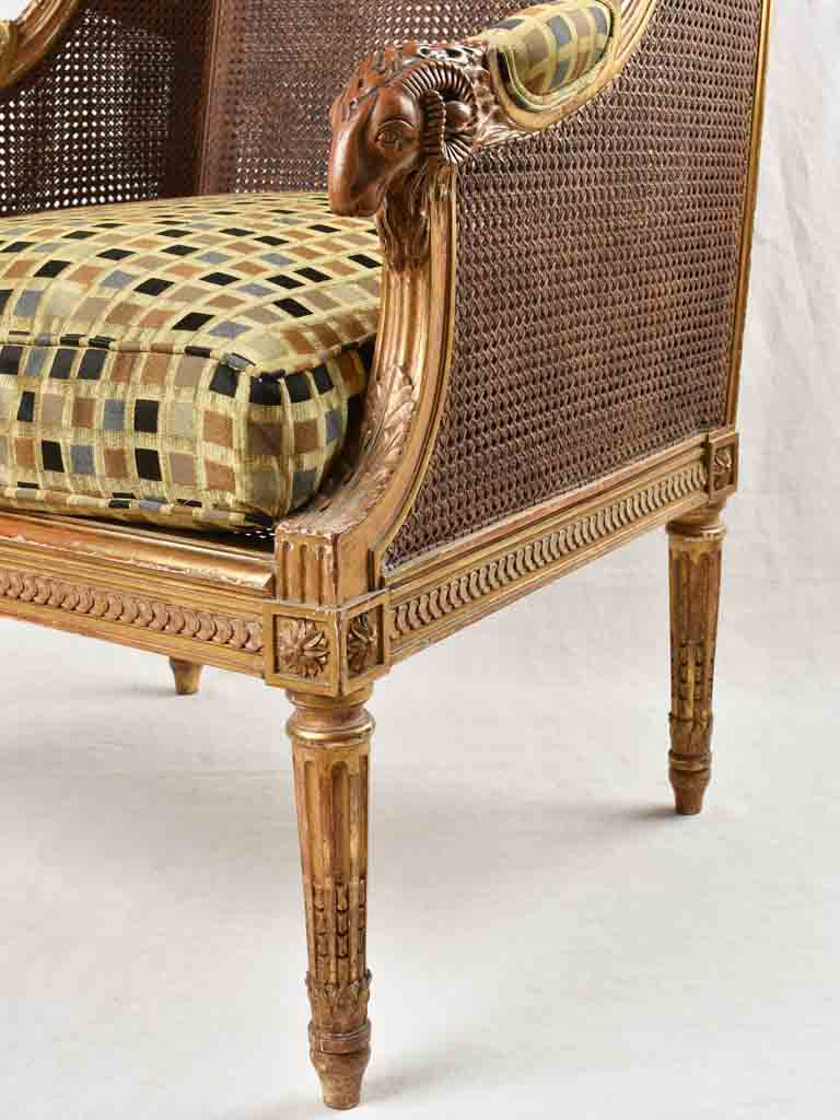 Large cane bergere armchair - ram's heads - 19th century