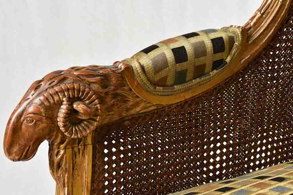Large cane bergere armchair - ram's heads - 19th century