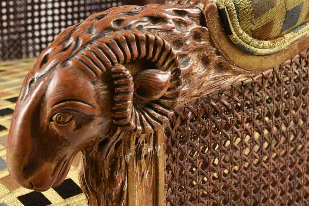 Large cane bergere armchair - ram's heads - 19th century