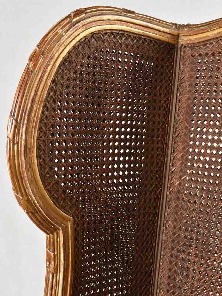 Large cane bergere armchair - ram's heads - 19th century
