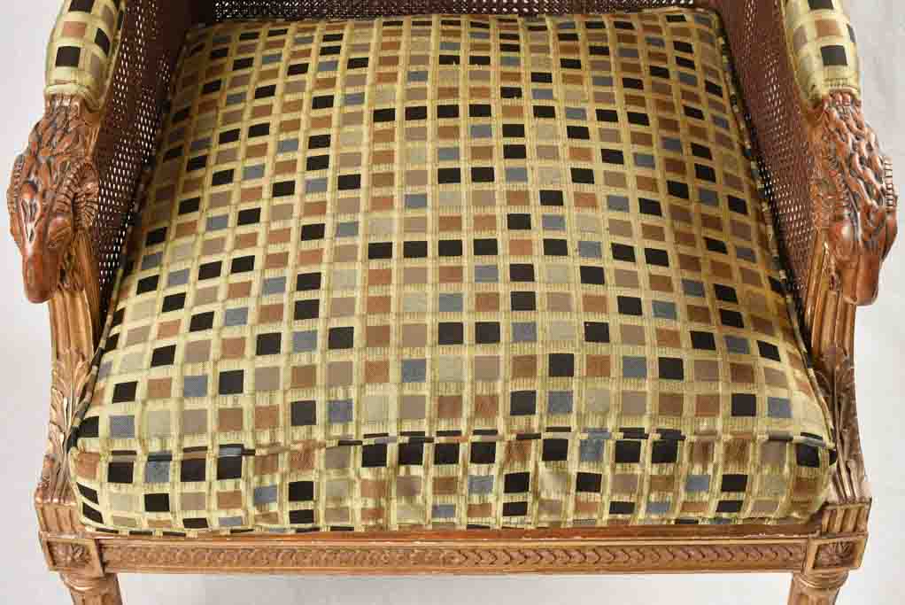 Large cane bergere armchair - ram's heads - 19th century
