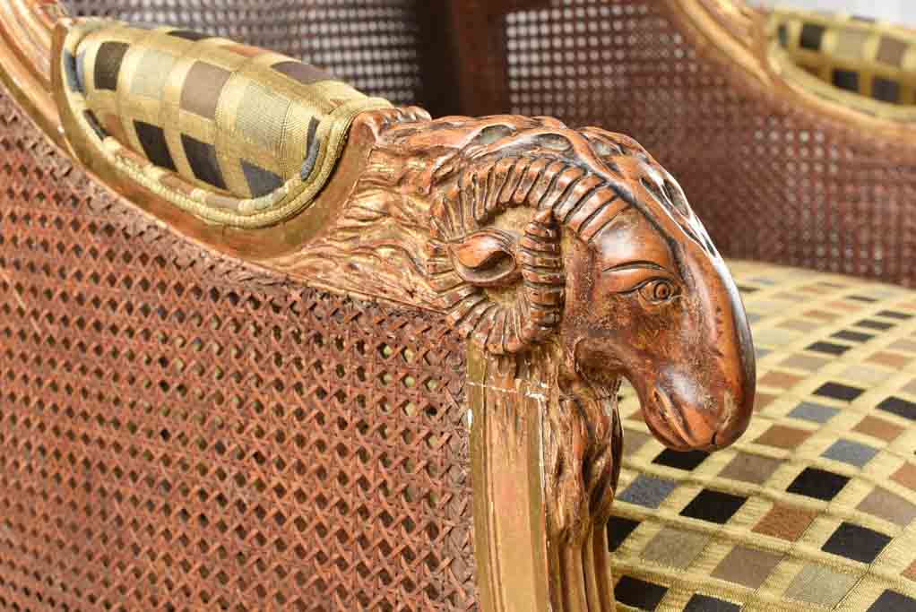 Large cane bergere armchair - ram's heads - 19th century