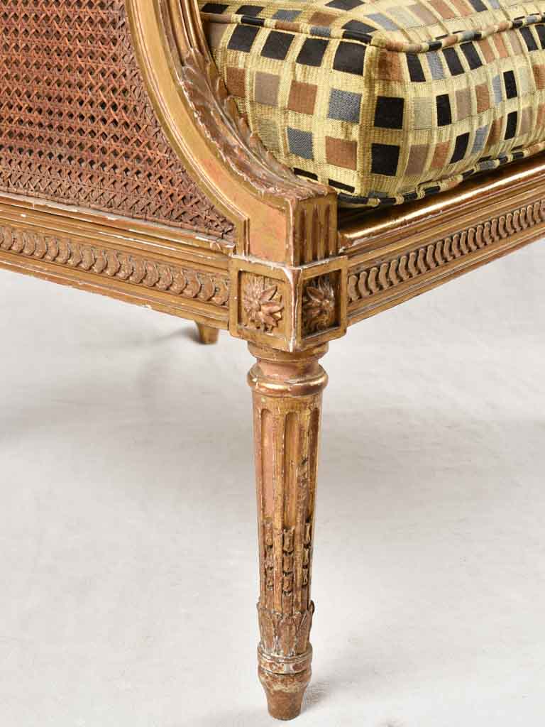 Large cane bergere armchair - ram's heads - 19th century