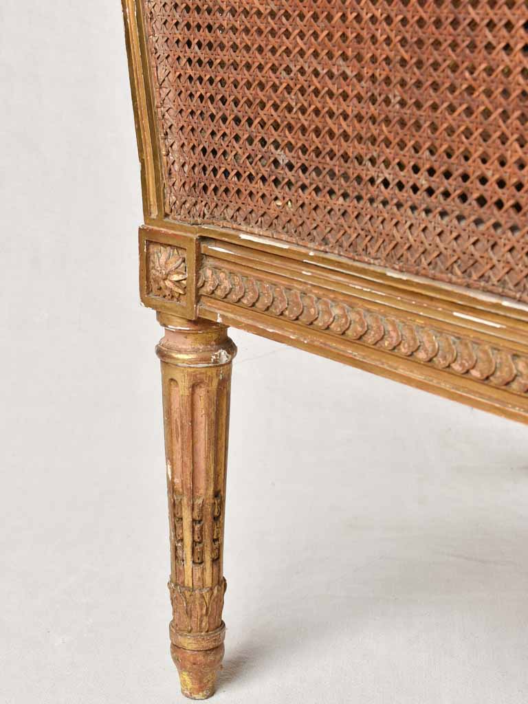 Large cane bergere armchair - ram's heads - 19th century