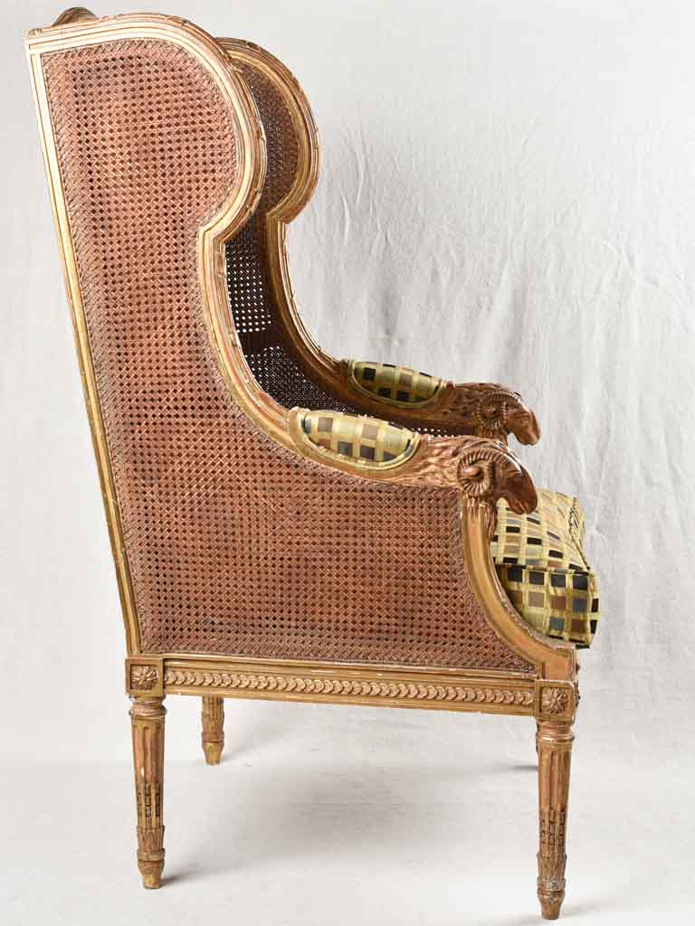 Large cane bergere armchair - ram's heads - 19th century