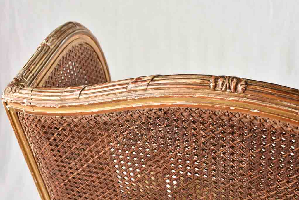 Large cane bergere armchair - ram's heads - 19th century