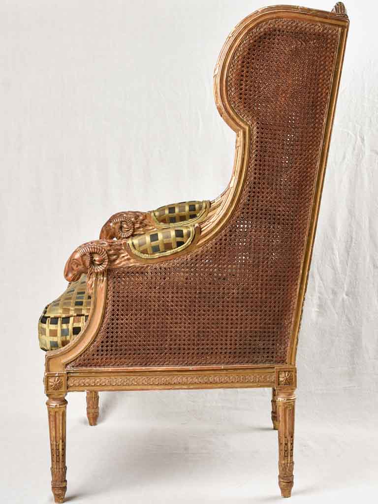 Large cane bergere armchair - ram's heads - 19th century