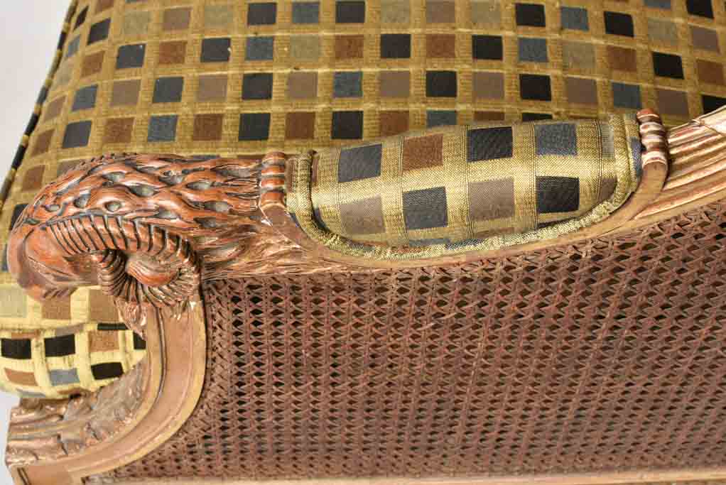 Large cane bergere armchair - ram's heads - 19th century