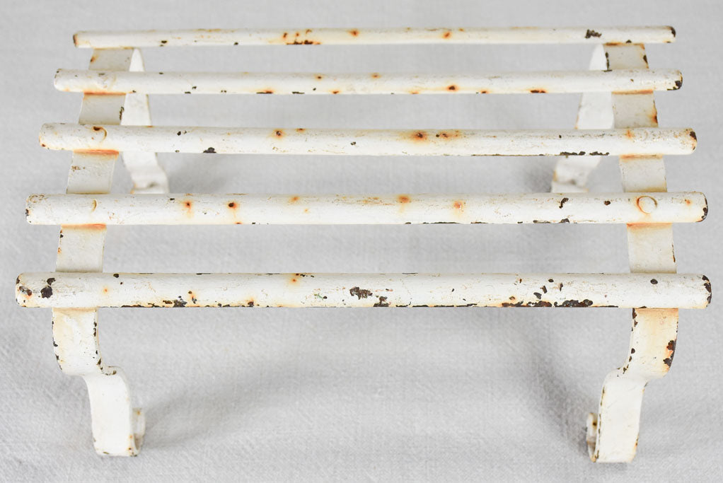 Early-twentieth-century wrought iron garden footrest with white patina