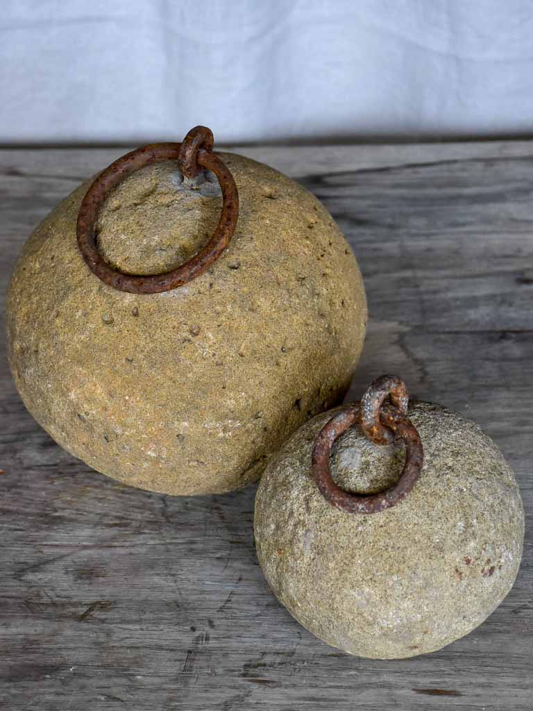 Two antique French counterweights with handles