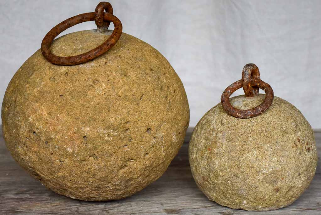Two antique French counterweights with handles