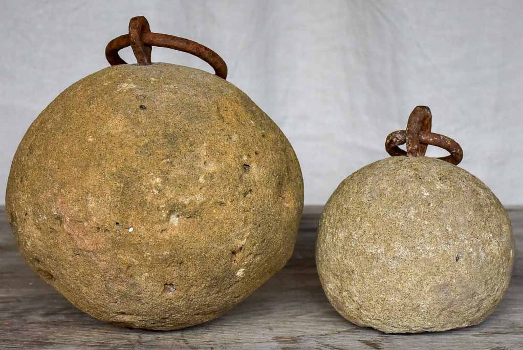 Two antique French counterweights with handles