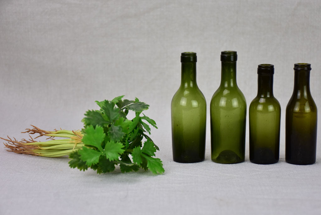 Collection of four miniature blown glass wine bottles from the 19th century 4¼"