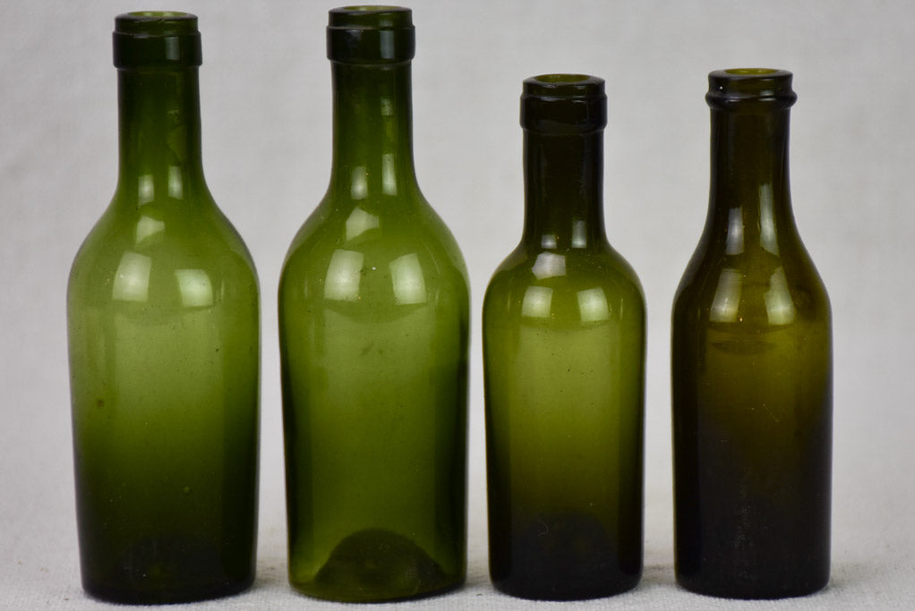 Collection of four miniature blown glass wine bottles from the 19th century 4¼"