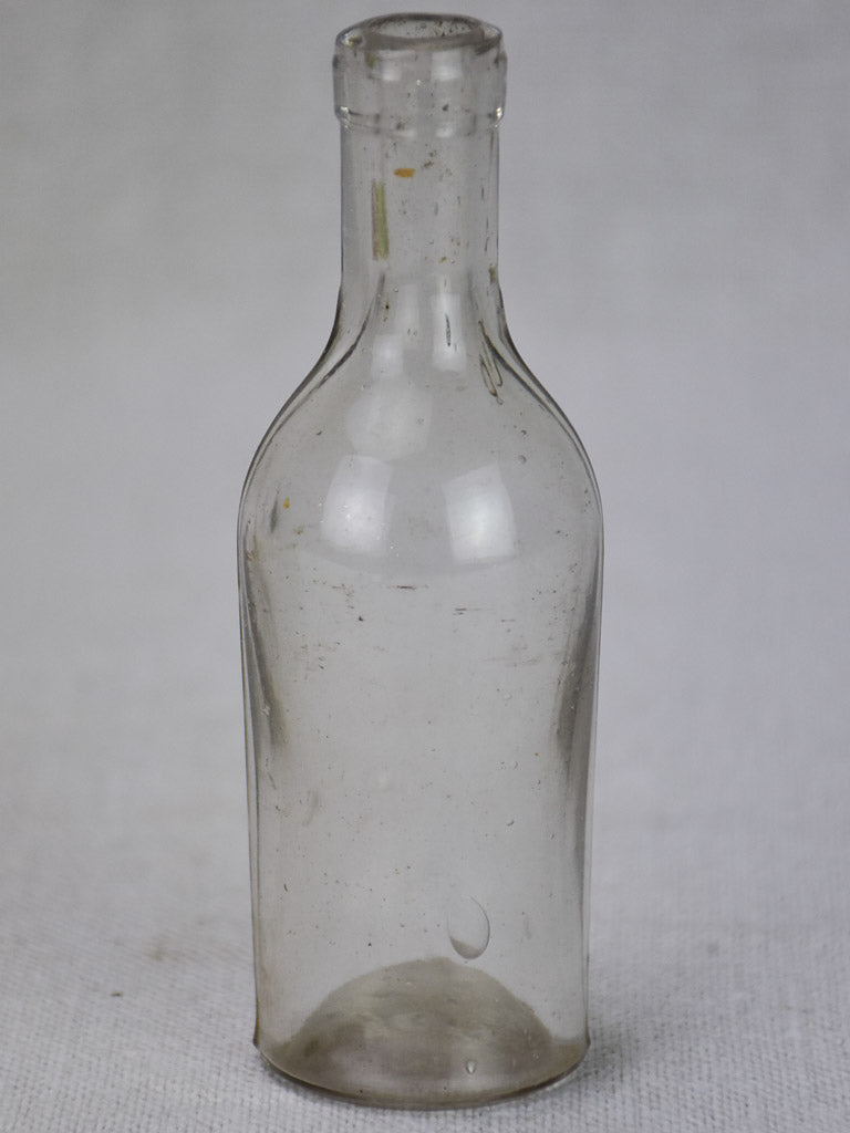 Miniature late 19th century blown glass bottle 4¾"
